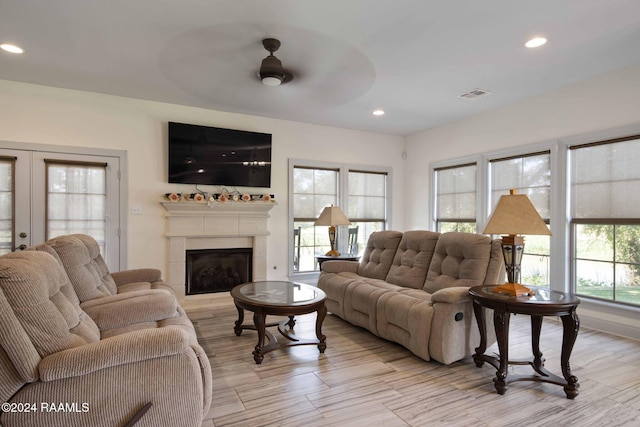 1053 Bayouside Ln, Parks, LA 70582 - living room with ceiling fan, visible vents, a tiled fireplace, light wood-type flooring, and recessed lighting