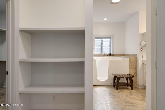 1053 Bayouside Ln, Parks, LA 70582 - bathroom with recessed lighting and a bathing tub