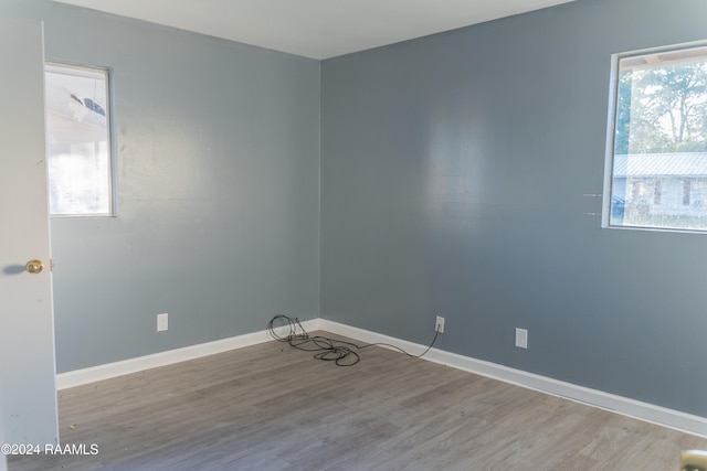 spare room with light hardwood / wood-style flooring