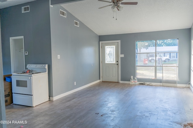 foyer with a textured ceiling, lofted ceiling, and hardwood / wood-style floors