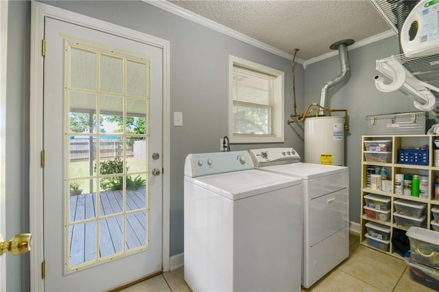 laundry area with laundry area, ornamental molding, a textured ceiling, washing machine and dryer, and water heater