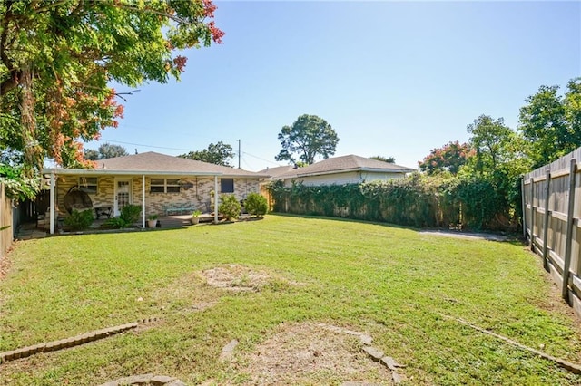 view of yard featuring a fenced backyard