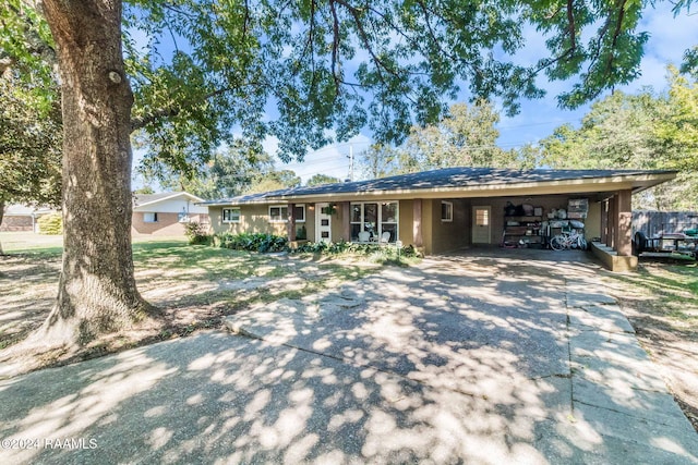 ranch-style home with a carport