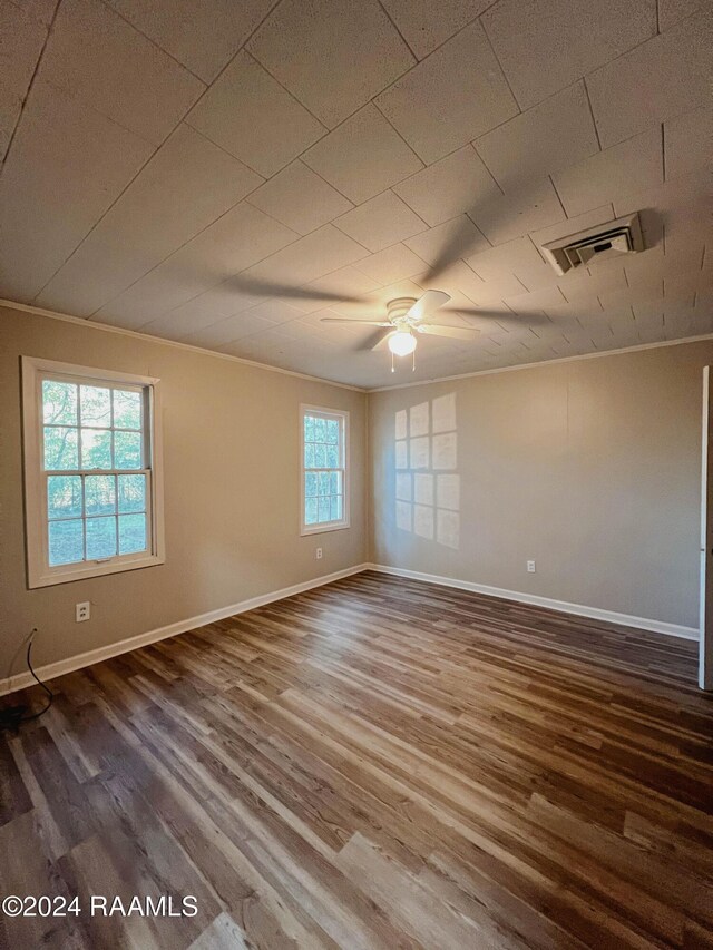 404 W Hickory St, Ville Platte, LA 70586 - unfurnished room with crown molding, baseboards, wood finished floors, and ceiling fan