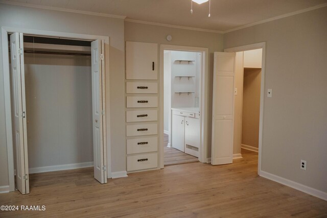 404 W Hickory St, Ville Platte, LA 70586 - unfurnished bedroom featuring light wood-style floors, ornamental molding, a closet, baseboards, and connected bathroom