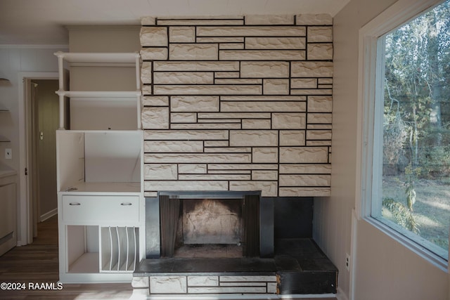 404 W Hickory St, Ville Platte, LA 70586 - detailed view of a fireplace, ornamental molding, and wood finished floors