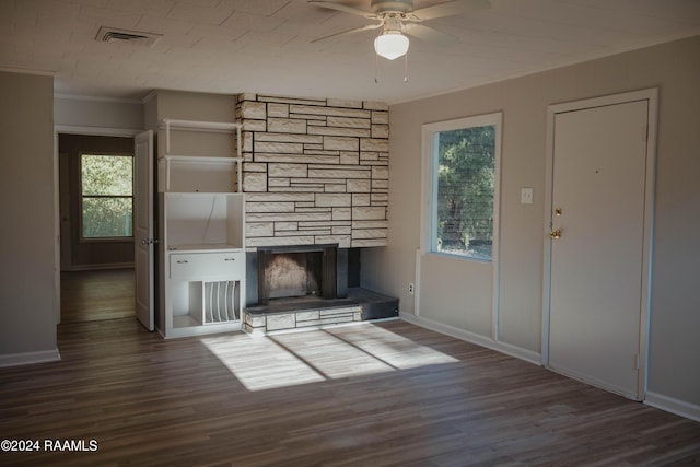 404 W Hickory St, Ville Platte, LA 70586 - unfurnished living room featuring ornamental molding, a ceiling fan, healthy amount of natural light, and wood finished floors
