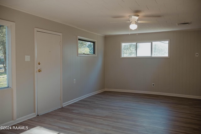 404 W Hickory St, Ville Platte, LA 70586 - spare room with wood finished floors, ceiling fan, baseboards, and crown molding