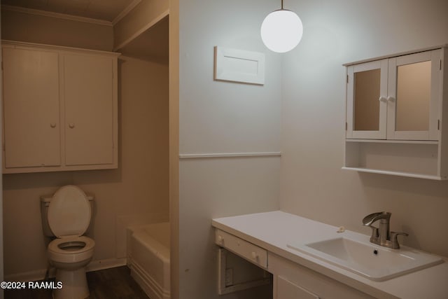 404 W Hickory St, Ville Platte, LA 70586 - full bathroom with toilet, a bathtub, vanity, and wood finished floors