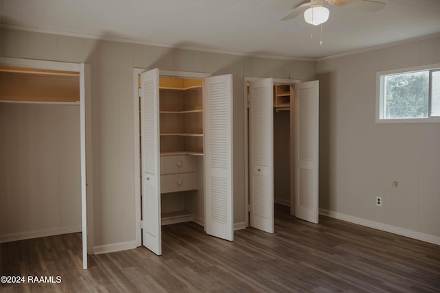 404 W Hickory St, Ville Platte, LA 70586 - unfurnished bedroom featuring ornamental molding, wood finished floors, two closets, and baseboards