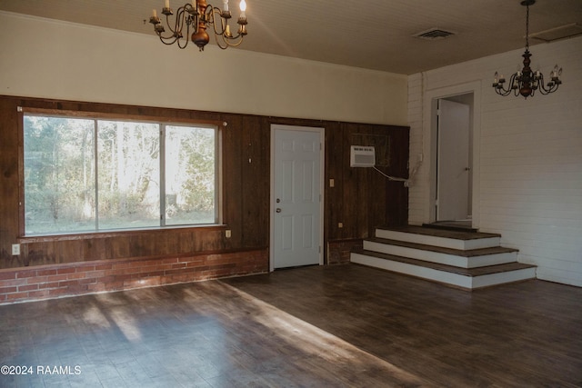 404 W Hickory St, Ville Platte, LA 70586 - foyer featuring a chandelier, wood finished floors, wood walls, stairway, and a wall unit AC