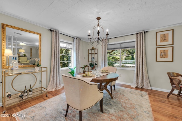 dining room featuring light hardwood / wood-style floors and a chandelier