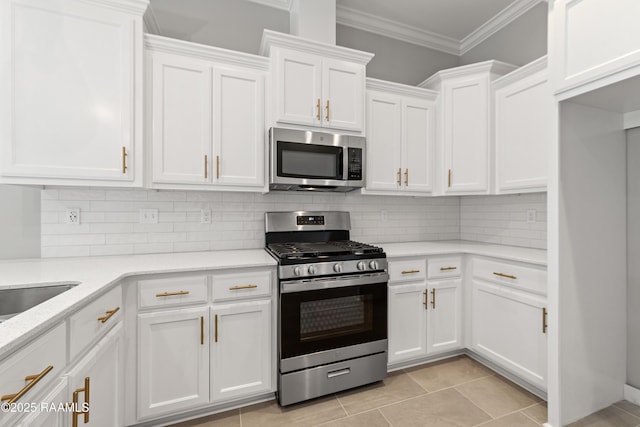 366 W Broussard Rd, Lafayette, LA 70506 - kitchen featuring appliances with stainless steel finishes, white cabinets, tasteful backsplash, ornamental molding, and light stone counters