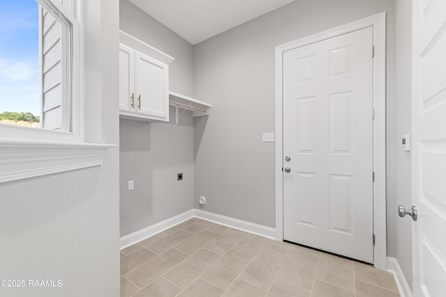 366 W Broussard Rd, Lafayette, LA 70506 - laundry area featuring hookup for an electric dryer, cabinet space, baseboards, and light tile patterned flooring
