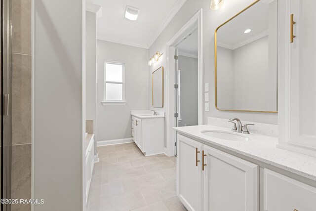 366 W Broussard Rd, Lafayette, LA 70506 - bathroom featuring ornamental molding, two vanities, a bath, baseboards, and tile patterned floors