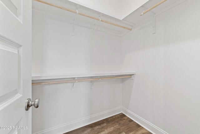 366 W Broussard Rd, Lafayette, LA 70506 - spacious closet featuring dark wood finished floors