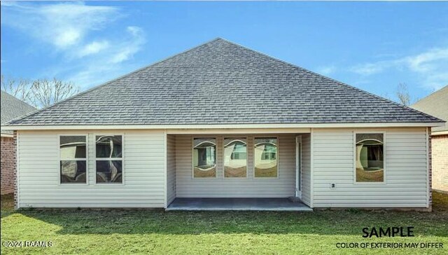 rear view of property with a patio area and a lawn