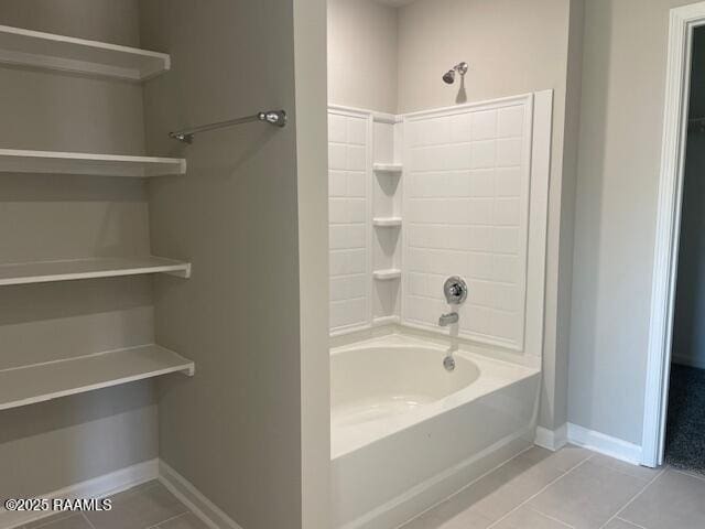 bathroom featuring shower / washtub combination and tile patterned flooring