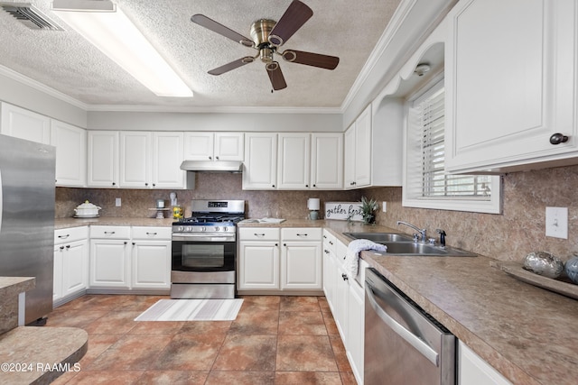 kitchen featuring stainless steel appliances, crown molding, sink, white cabinets, and a textured ceiling