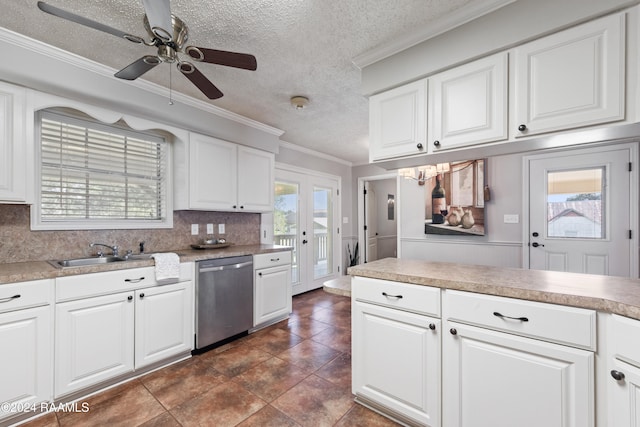 kitchen featuring dishwasher, sink, white cabinetry, crown molding, and decorative backsplash