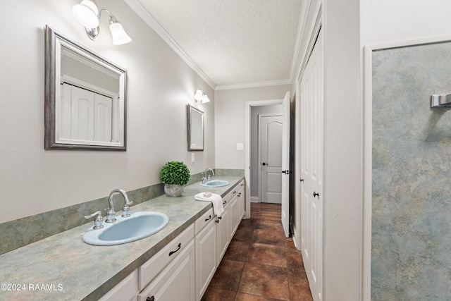 bathroom with vanity, ornamental molding, a textured ceiling, and tile patterned flooring