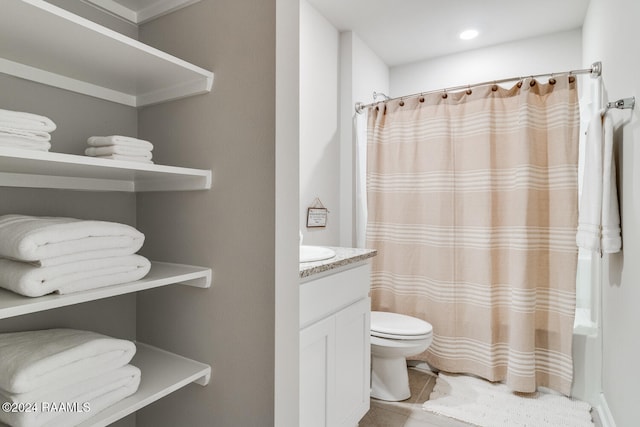 full bathroom with toilet, tile patterned flooring, vanity, and shower / tub combo