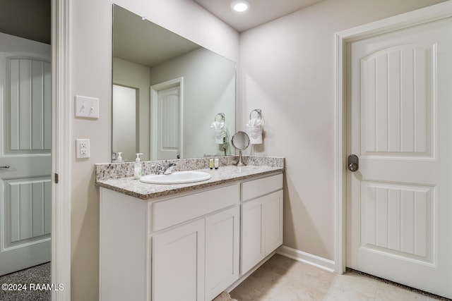 bathroom with vanity and tile patterned flooring