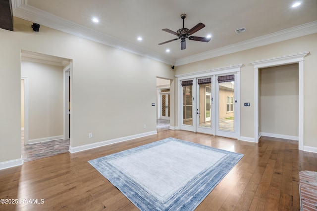 interior space featuring ceiling fan, ornamental molding, and wood-type flooring