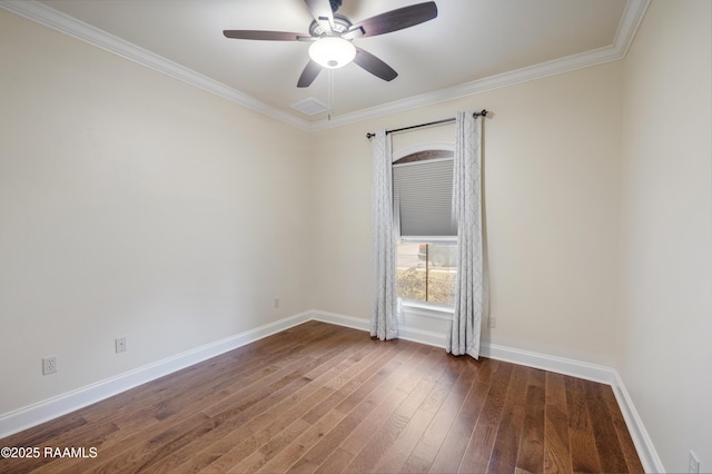 spare room with dark wood-type flooring, ornamental molding, and ceiling fan