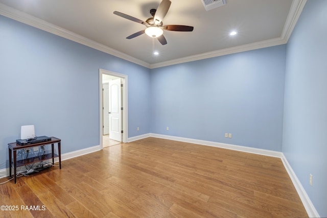 spare room with crown molding, ceiling fan, and light wood-type flooring