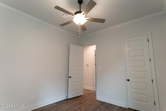 spare room with crown molding, ceiling fan, and dark hardwood / wood-style floors