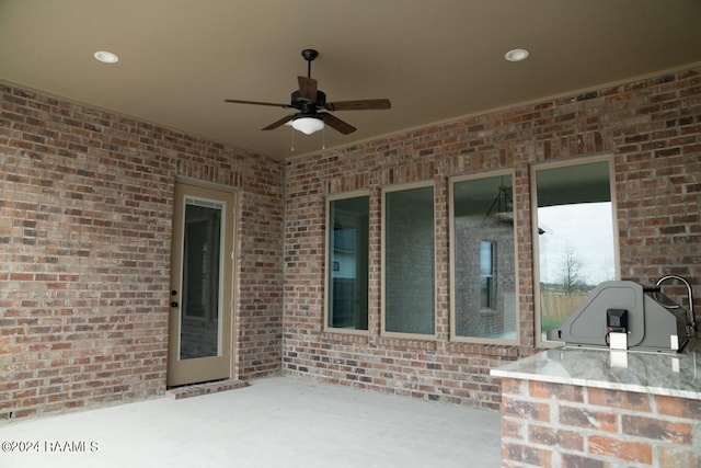 view of patio / terrace with area for grilling and ceiling fan