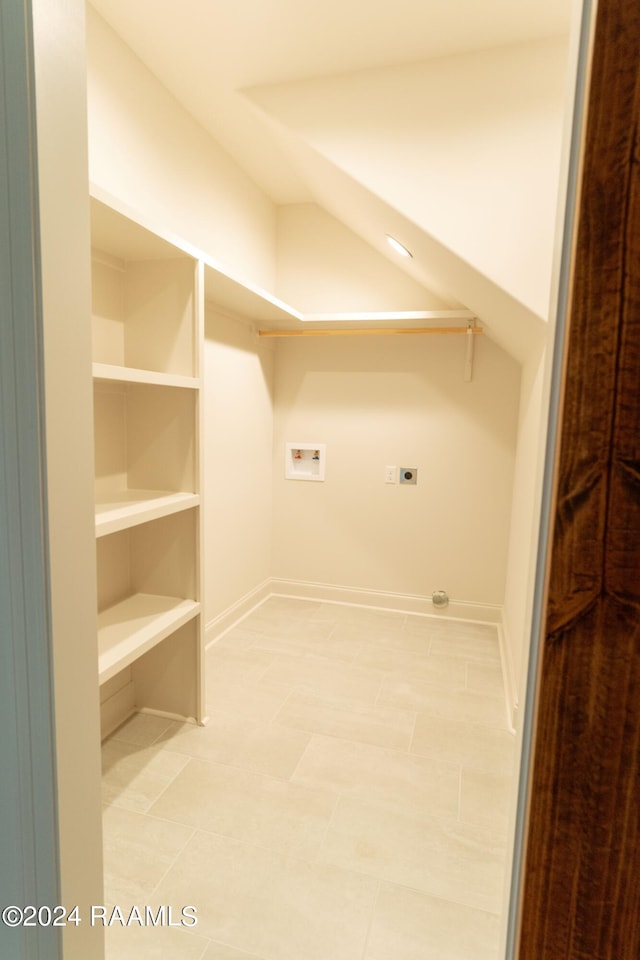 laundry area with washer hookup, light tile patterned floors, and electric dryer hookup