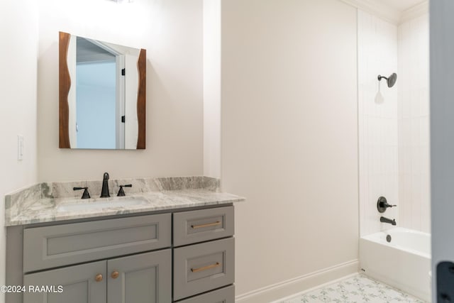 bathroom featuring crown molding, tile patterned flooring, vanity, and tiled shower / bath