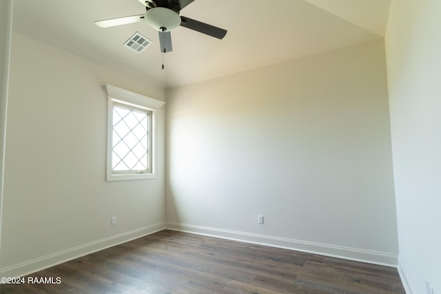 empty room with ceiling fan and dark wood-type flooring