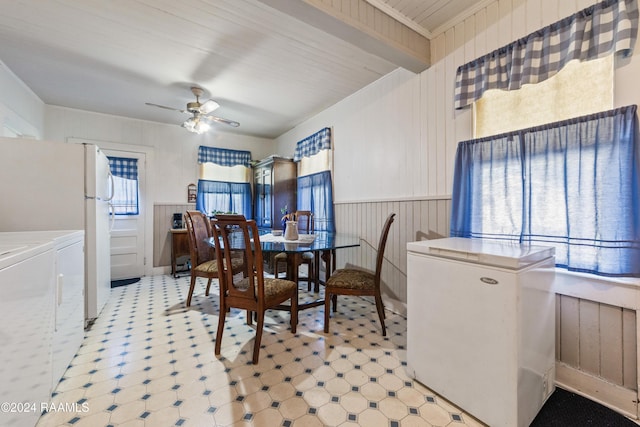 220 Saint Peter St, Lafayette, LA 70506 - dining room featuring light flooring, ceiling fan, a wainscoted wall, and wood walls