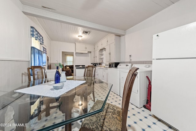 220 Saint Peter St, Lafayette, LA 70506 - dining room featuring independent washer and dryer, light floors, wooden ceiling, and wainscoting