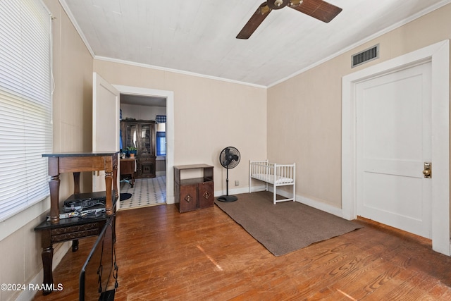 220 Saint Peter St, Lafayette, LA 70506 - living area featuring ceiling fan, wood finished floors, and ornamental molding