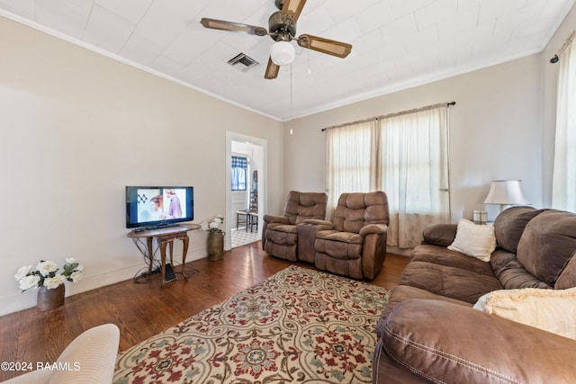 living room with ceiling fan, dark hardwood / wood-style floors, and ornamental molding