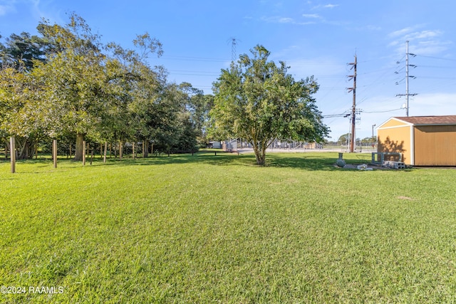 220 Saint Peter St, Lafayette, LA 70506 - view of grassy yard featuring an outdoor structure