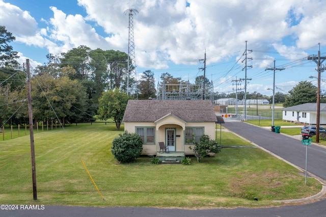 220 Saint Peter St, Lafayette, LA 70506 - view of front of property with a front yard, an outdoor structure, and a shingled roof