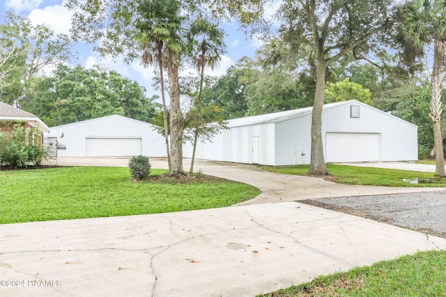 garage featuring a yard