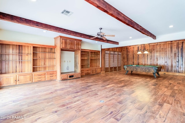 game room with beam ceiling, wooden walls, hardwood / wood-style flooring, pool table, and ceiling fan