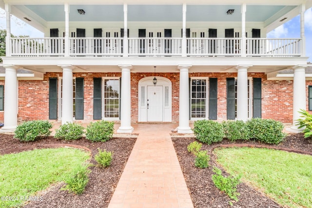 doorway to property featuring a balcony
