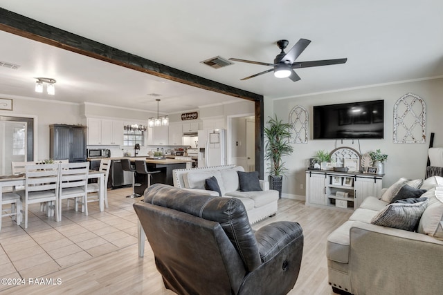 living room featuring beamed ceiling, ceiling fan with notable chandelier, light hardwood / wood-style floors, and crown molding