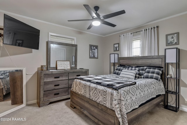 bedroom with light carpet, ceiling fan, and crown molding