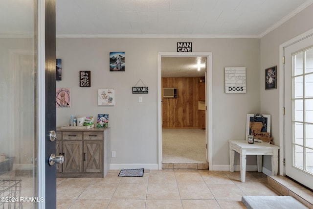 interior space with plenty of natural light, light tile patterned flooring, and ornamental molding