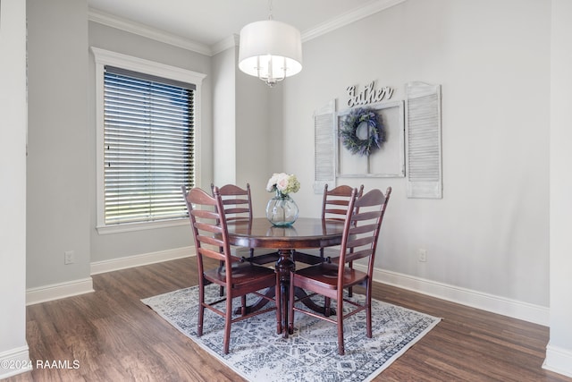 dining space featuring dark hardwood / wood-style floors and ornamental molding