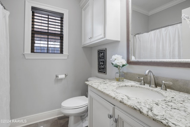 bathroom featuring crown molding, tile patterned flooring, vanity, and toilet