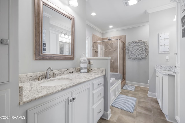 bathroom with plus walk in shower, vanity, crown molding, and tile patterned flooring